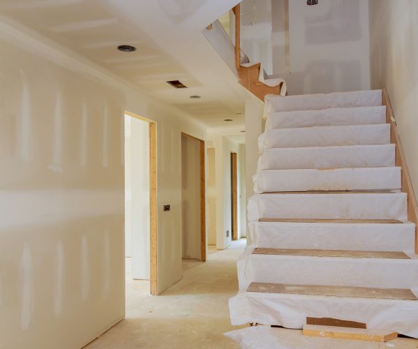 New home interior construction of housing with drywall installed